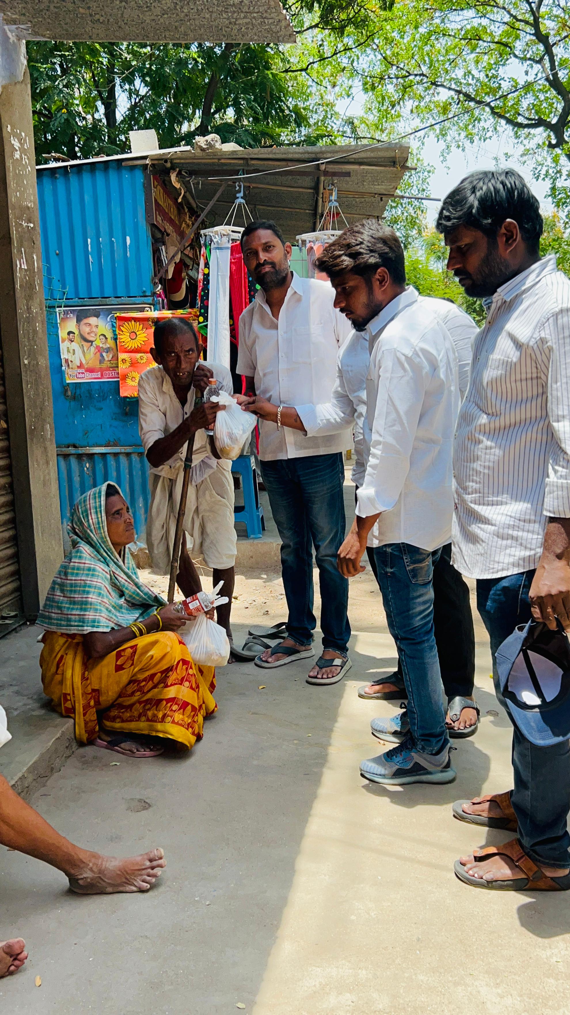 Street-side food distribution to elderly and needy